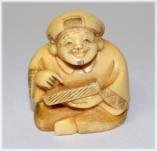 Дайкоку, один из Семи Богов Счастья, нэцкэ из слоновой кости, 1900-е гг.